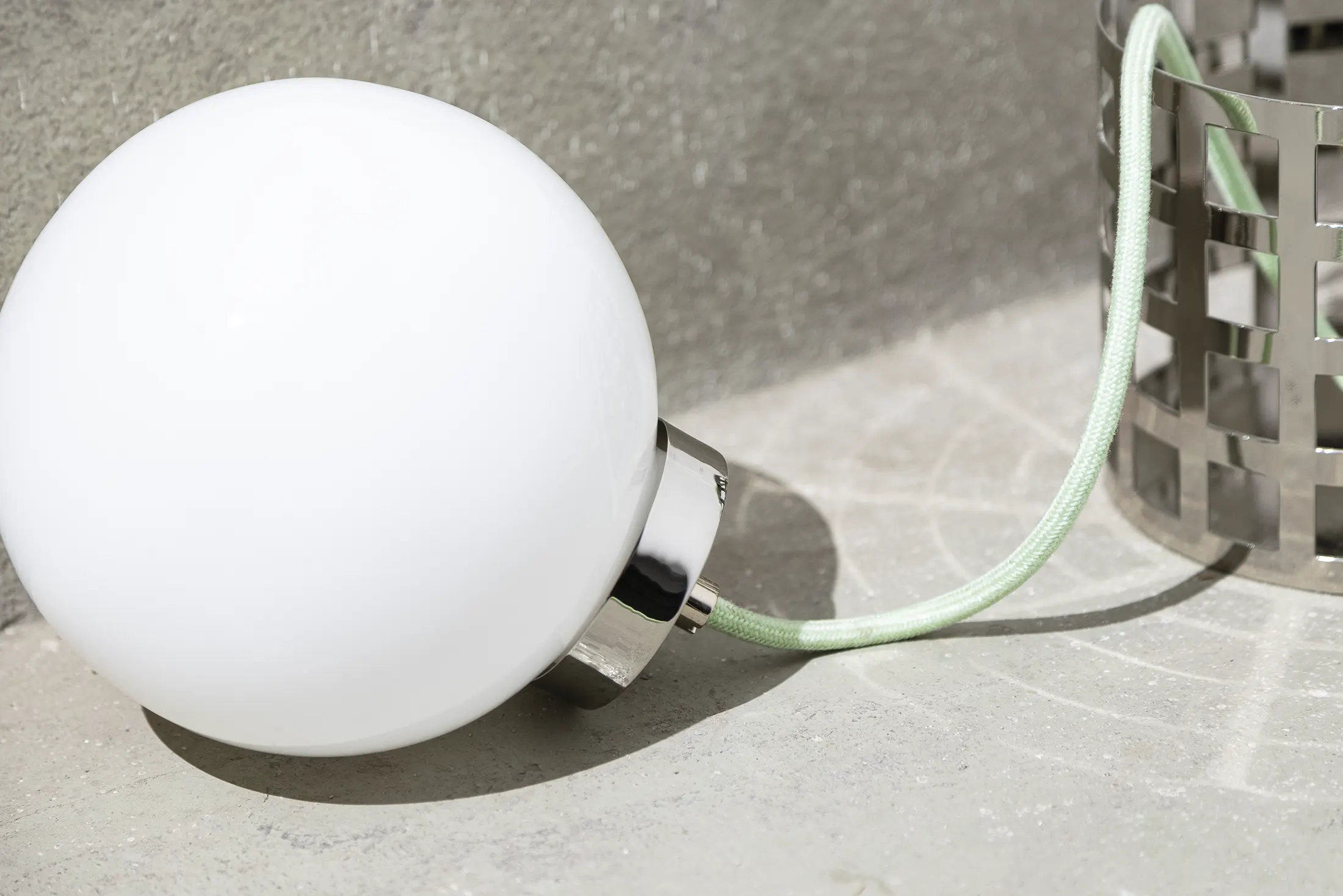 Full Moon Ride Table Lamp - Inspired by the iconic chrome finishes of the Mid Century era. Features a meticulously crafted grid pattern accentuating its geometric harmony. Conceptually alluring and transcending boundaries of conventional lighting.